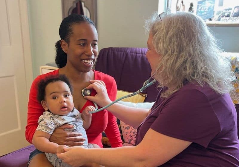 A person holds a baby.